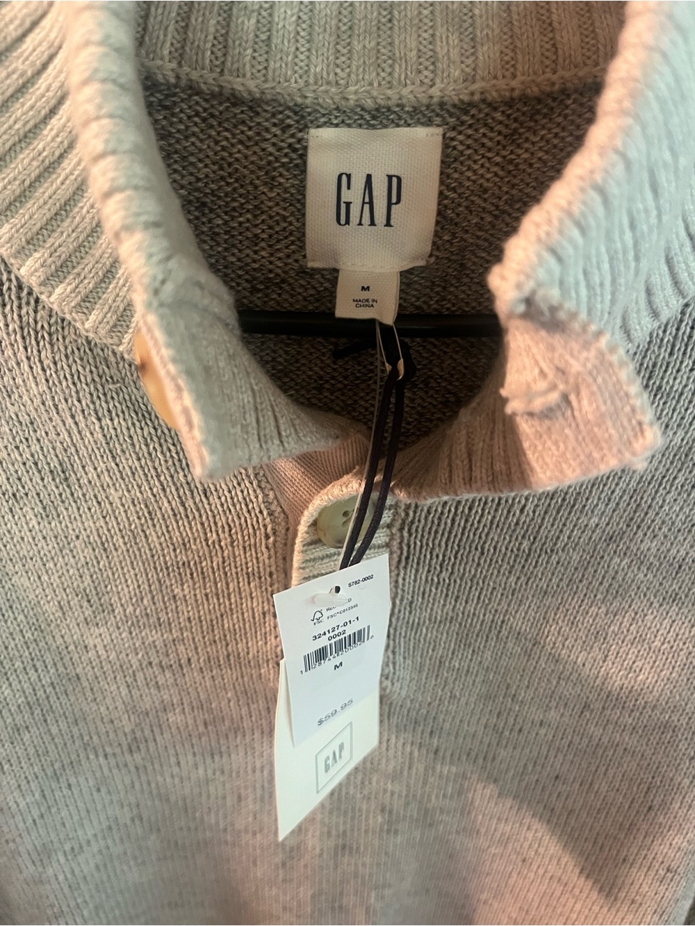 GAP Men’s Long-sleeve pullover sweater featuring a buttoned Henley neckline